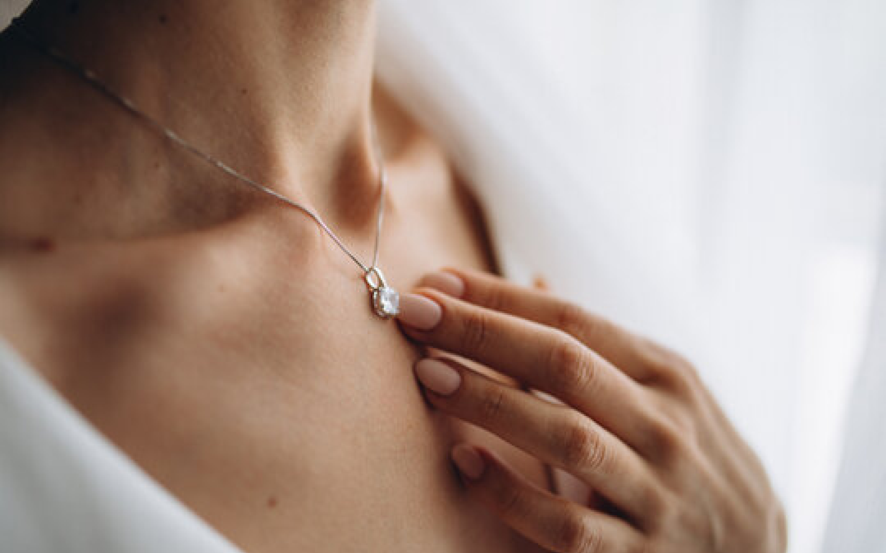 Customer wearing a delicate necklace